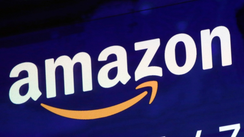 A logo for Amazon is displayed on a screen at the Nasdaq MarketSite, July 27, 2018. Amazon workers in upstate New York filed a petition for a union election on Tuesday, Aug. 16, 2022. (AP Photo/Richard Drew, File)