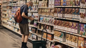 A man shops at a supermarket on Wednesday, July 27, 2022, in New York. (AP Photo/Andres Kudacki) 