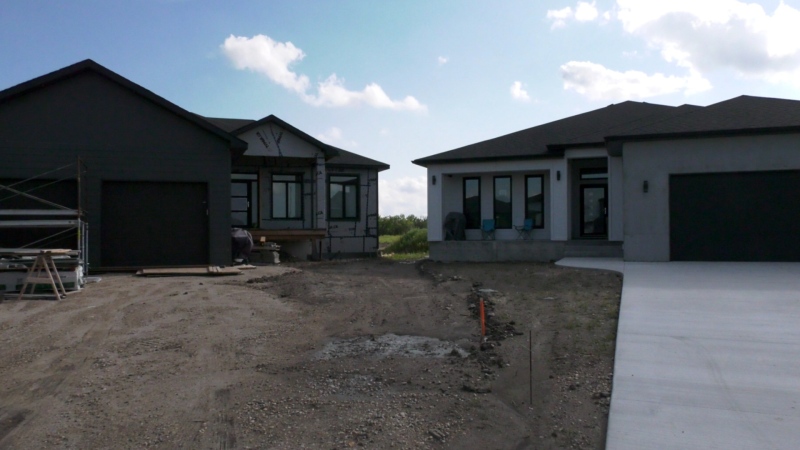 Steinbach City Council approved a variance request on Aug. 16, 2022, to allow the house (right) which was built too close to the property line to stay where it is. (Source: Danton Unger/ CTV News Winnipeg)