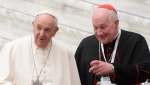 Pope Francis, left, and Cardinal Marc Ouellet arrive at the opening of a 3-day Symposium on Vocations in the Paul VI hall at the Vatican, Thursday, Feb. 17, 2022. (AP Photo/Gregorio Borgia) 