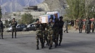 In this photo provided by the Indian Army, soldiers carry the remains of Chandra Shekhar, an Indian army soldier found more than 38 years after he went missing, in Leh, India, Wednesday, Aug. 17, 2022. (Indian Army via AP)