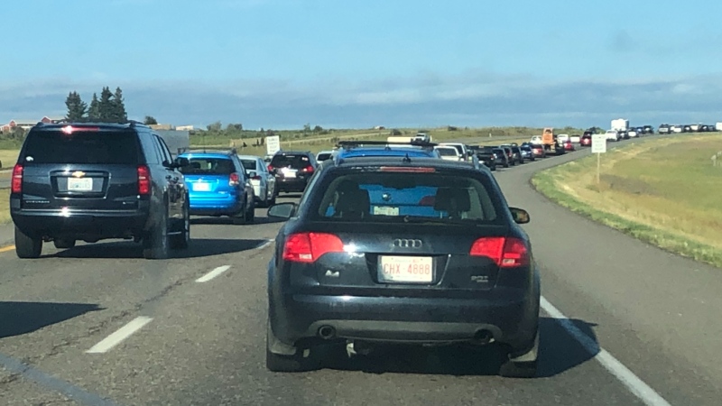 Traffic backups in the westbound lanes of Highway 1, west of Calgary, following Wednesday morning's fatal crash near Hermitage Road.