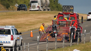 A motorcycle fastened on a tow truck following Wednesday morning's crash on the Trans-Canada Highway west of Calgary.
