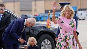 U.S. President Joe Biden looks at his grandson Beau Biden as first lady Jill Biden waves and walks to board Air Force One at Andrews Air Force Base, Md., Aug. 10, 2022. 