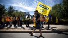 Members of the British Columbia General Employees' Union picket outside a B.C. Liquor Distribution Branch facility, in Delta, B.C., on Monday, August 15, 2022. (THE CANADIAN PRESS/Darryl Dyck)