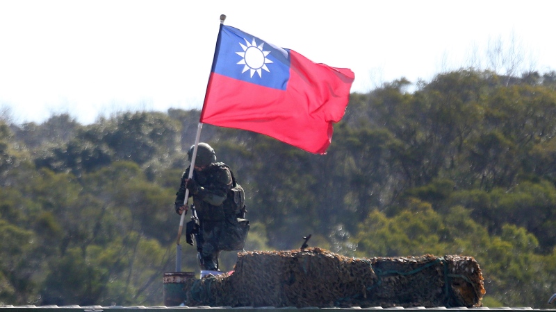 In this Jan. 19, 2021, file photo, a soldier holds a Taiwanese flag during a military exercise aimed at repelling an attack from China in Hsinchu County, northern Taiwan.(AP Photo/Chiang Ying-ying, File) 