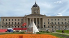 An encampment on the front lawn of the Manitoba legislature building as shown on Wednesday Aug. 17, 2022 in Winnipeg was given an eviction notice. A handful of police were present as the notices were given to demonstrators on the north and east sides of the legislative building Wednesday morning. THE CANADIAN PRESS/Kelly Malone