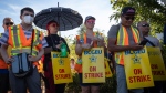 Members of the B.C. General Employees' Union picket outside a B.C. Liquor Distribution Branch facility, in Delta, B.C., on Monday, August 15, 2022. THE CANADIAN PRESS/Darryl Dyck 