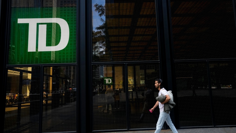 A man walks past the TD Bank in the Bay Street Financial District in Toronto on Friday, August 5, 2022. THE CANADIAN PRESS/Nathan Denette
