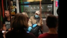 FILE - In this Sept. 12, 2021, an elderly man wearing a face mask and gloves to protect against the coronavirus rides a subway car in Moscow, Russia. (AP Photo/Alexander Zemlianichenko, File)
