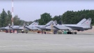 In this handout photo taken from video released by Russian Defence Ministry Press Service on Thursday, Aug. 18, 2022, three MiG-31 fighter jets of the Russian air force stand after lending at the Chkalovsk air base in the Kaliningrad region. (Russian Defence Ministry Press Service photo via AP)