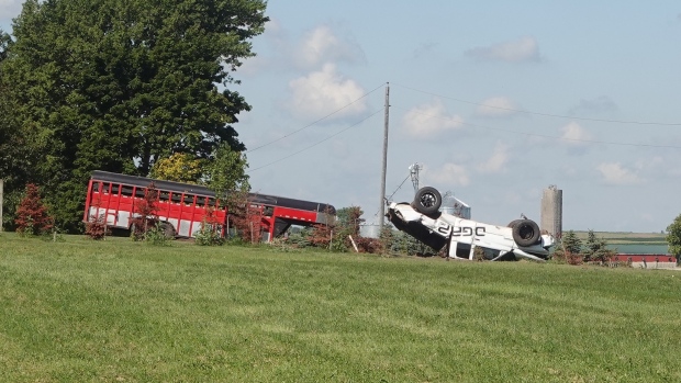 OPP in Elgin County are on scene of a crash involving an electric bike and a pickup truck hauling a livestock trailer on Aug. 18, 2022. (Marek Sutherland/CTV News London)