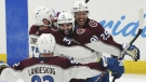 Colorado Avalanche center Nazem Kadri (91) is congratulated by teammates after his overtime goal on Tampa Bay Lightning goaltender Andrei Vasilevskiy (88) in Game 4 of the NHL hockey Stanley Cup Finals on Wednesday, June 22, 2022, in Tampa, Fla. (AP Photo/John Bazemore)