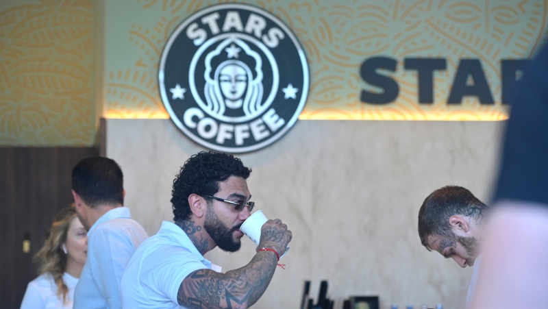 Russian singer and entrepreneur Timur Yunusov, better known as Timati, drinks coffee at a newly opened Stars Coffee coffee shop in the former location of the Starbucks coffee shop in Moscow, Russia, Thursday, Aug. 18, 2022.