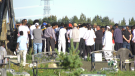 Members of Edmonton's Somali community attend a service for 14-year-old Hassan Mohamed, who drowned at Rotary Park in Whitecourt on Aug. 14, 2022.