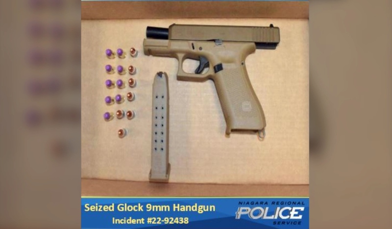 During the arrest, officers found a loaded Glock 9mm handgun inside a satchel being worn by the accused. (Provided)