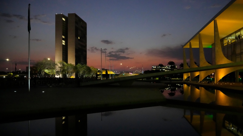 Planalto presidential palace, right, and the National Congress building during the sunset in Brasilia, Brazil, Monday, Sept. 6, 2021. Samuel Vieira de Souza, a retired Army colonel, has been removed from his position of director of the Brazilian Institute of the Environment and Renewable Natural Resources, IBAMA. (AP Photo/Eraldo Peres, File)
