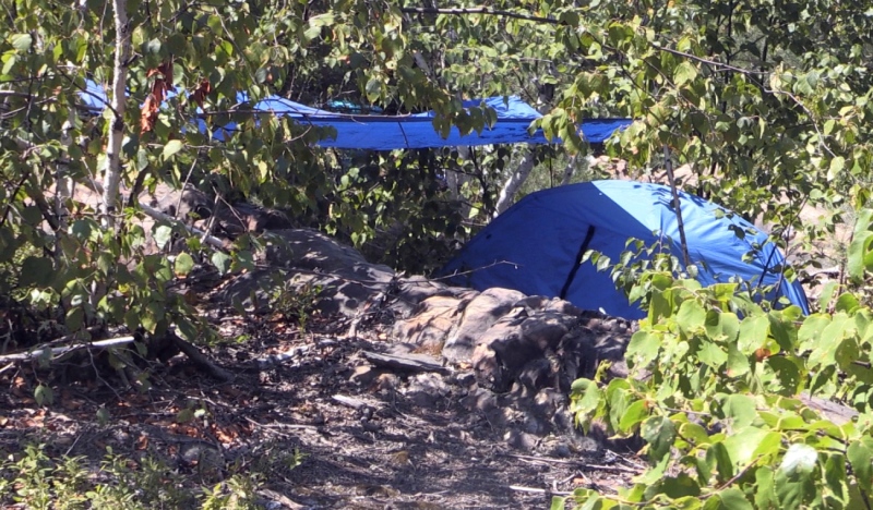 An encampment is setup in the bush off Ramsey Lake Road, on city property. The bylaw department confirmed it has received several complaints about the encampment. (Alana Everson/CTV News Northern Ontario)