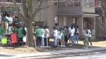 Partygoers are seen outside a London, Ont. home on St. Patrick’s Day 2022. (Daryl Newcombe/CTV News London)