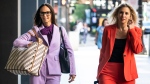 R. Kelly's defence attorneys, Jennifer Bonjean, left, and Ashley Cohen, walk into the Dirksen Federal Courthouse in Chicago, Wednesday morning, Aug. 17, 2022. (Ashlee Rezin/Chicago Sun-Times via AP)