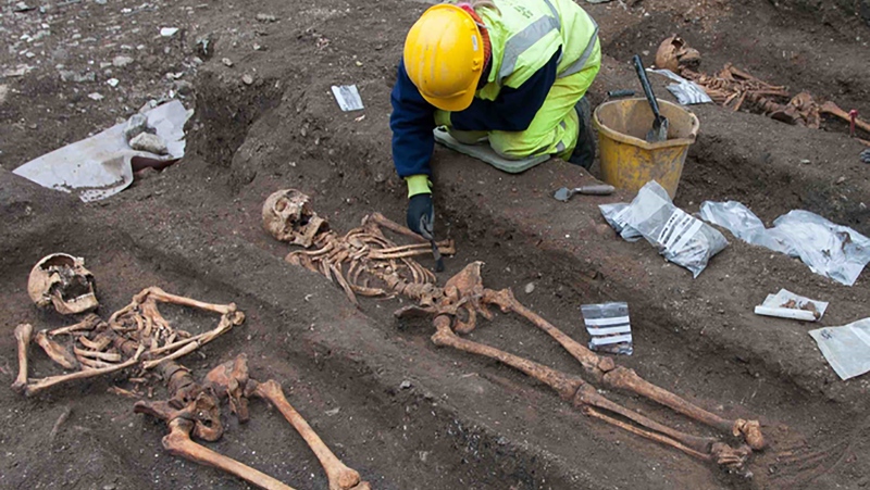 Archeologists from the Cambridge Archeological Unit excavate the remains of friars buried in the grounds of the former Augustinian friary in central Cambridge. (Cambridge Archaeological Unit/CNN)