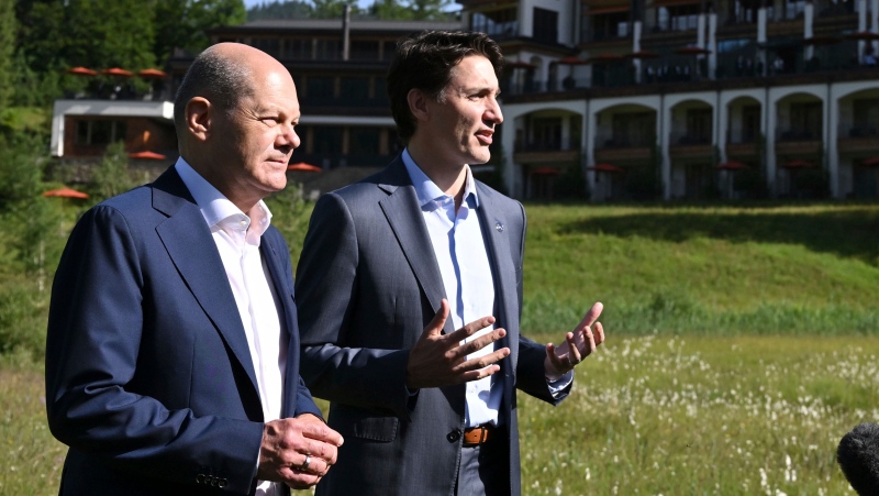German Chancellor Olaf Scholz, left, and the Prime Minister of Canada, Justin Trudeau, right, give a statement during their bilateral meeting on the sidelines of the G7 summit at Castle Elmau in Kruen, near Garmisch-Partenkirchen, Germany, on Monday, June 27, 2022. The Group of Seven leading economic powers are meeting in Germany for their annual gathering Sunday through Tuesday. (Kerstin Joensson/Pool Photo via AP)