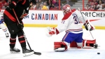 Ottawa Senators centre Josh Norris (9) scores on Montreal Canadiens goaltender Carey Price (31) during second period NHL hockey action in Ottawa, on Saturday, April 23, 2022. THE CANADIAN PRESS/Justin Tang