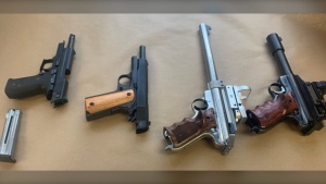 Edmonton police executed a search warrant at a Griesbach home on July 28, 2022, seizing drugs worth an estimated total of $140,000 and four stolen handguns and ammunition, worth about $42,000. (Photo provided.)