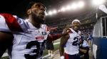 Montreal Alouettes' Keishawn Bierria (33) and Avery Ellis (23) celebrate a win during overtime CFL action against the Winnipeg Blue Bombers in Winnipeg Thursday, August 11, 2022. THE CANADIAN PRESS/John Woods