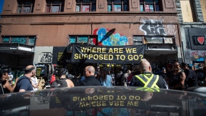 Indigenous organizations, tent city residents and others hold a news conference outside the former single room occupancy Balmoral Hotel to protest the city's ongoing removal of a homeless encampment on the sidewalks in the Downtown Eastside of Vancouver, on Tuesday, August 16, 2022. THE CANADIAN PRESS/Darryl Dyck