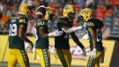 Edmonton Elks' Derel Walker (87), right, celebrates his touchdown with teammates, Kenny Lawler (89), Chris Osei-Kusi (18), and Kai Locksley (10) during second half CFL action against the Ottawa Redblacks in Ottawa on Friday, August 19, 2022 (The Canadian Press/Patrick Doyle).