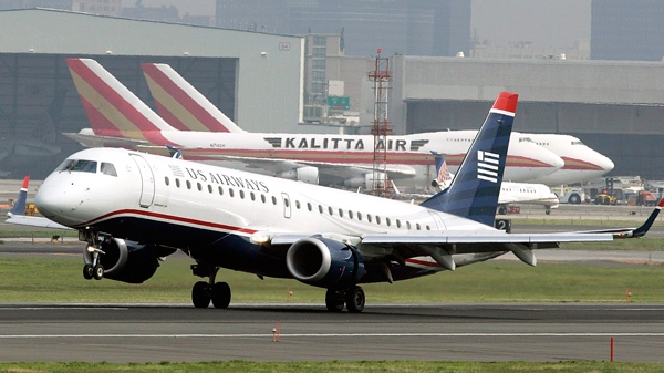 A US Airways aircraft lands at Newark Liberty International Airport in Newark, N.J. on June 27, 2008. (AP / Mel Evans)