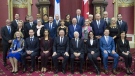 Quebec Premier Francois Legault poses with his cabinet during a ceremony at the National Assembly Thursday, October 18, 2018 at the legislature in Quebec City. From the left, first row, Minister of Seniors Marguerite Blais, Minister of Finances Eric Girard, Deputy Premier Genevieve Guilbault, Premier Francois Legault, Lt.-Gov. J. Michel Doyon, Minister of Justice Sonia LeBel, Minister of Immigration and House Leader Simon Jolin-Barrette, second row, Minister of Labour and Employment Jean Boulet, Minister of Tourism Caroline Proulx, Minister of Digital Transformation Eric Caire, Junior Transport Minister Chantal Rouleau, Minister of Transport Francois Bonnardel, Minister of Culture and Communications Nathalie Roy, Treasury Board president Christian Dube, Minister of Environment Marie Chantal Chasse, Minister of Economy and Innovation Pierre Fitzgibbon, Minister of Municipal Affairs and Housing AndrÃƒÂ©e Laforest, third row, Minister of Education Jean-Francois Roberge, Junior Economic Development Minister Marie-Eve Proulx, Junior Health Minister Lionel Carmant, Minister of International Relations and Francophonie Nadine Girault, Minister of Energy and Natural Resources Jonatan Julien, Junior Education Minister Isabelle Charest, Minister of Agriculture and Fisheries Andre Lamontagne, Minister of Native Affairs Sylvie D'Amours, Minister of Forest Wildlife and Parks Pierre Dufour, Minister of Families Mathieu Lacombe. THE CANADIAN PRESS/Jacques Boissinot