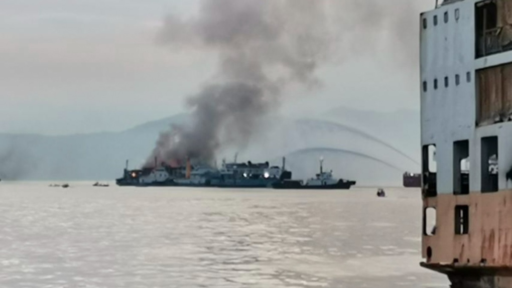 Smoke is seen from the M/V Asia Philippines