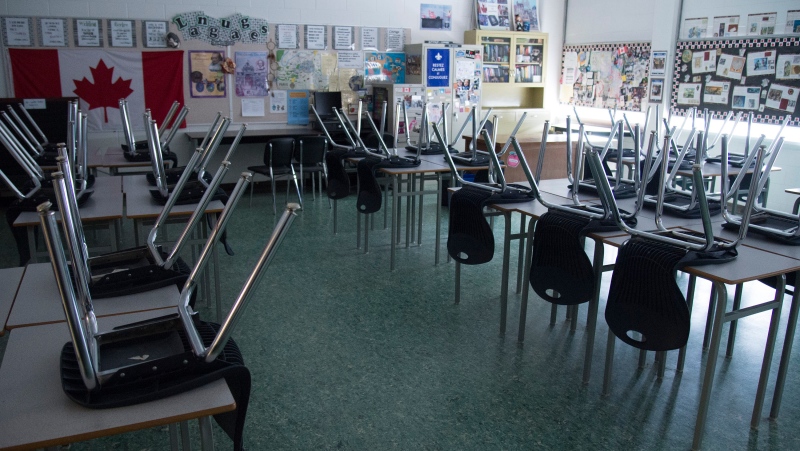A empty classroom is pictured at Eric Hamber Secondary school in Vancouver, B.C. Monday, March 23, 2020. The Saskatchewan government says schools will remain closed until at least September. THE CANADIAN PRESS/Jonathan Hayward