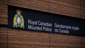 The RCMP logo is seen outside Royal Canadian Mounted Police "E" Division Headquarters, in Surrey, B.C., on Friday April 13, 2018. THE CANADIAN PRESS/Darryl Dyck 