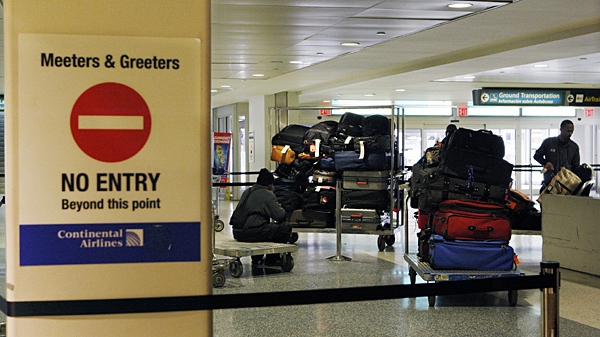 A no entry sign is seen near carts of baggage at an international flights gate at Newark Liberty International Airport, in Newark, N.J., Monday, Jan. 4, 2010. (AP / Mel Evans)