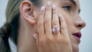 A large, pure pink, diamond before it is offered at auction, on display at Sotheby's, on Aug. 31, 2022. (Yui Mok / Pool Photo via AP) 