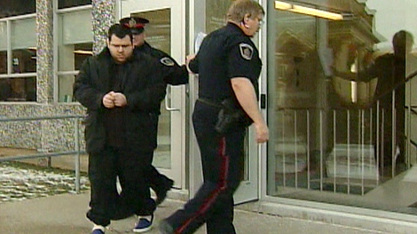 Trevor LaPierre, 24, is led out of court in this undated image.