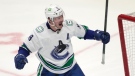 Vancouver Canucks center J.T. Miller celebrates after scoring a goal against the Colorado Avalanche in Denver on March 23, 2022. (AP Photo/David Zalubowski)