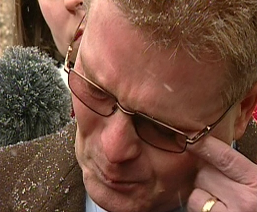 Eric Tillman, the general manager of the Saskatchewan Roughriders, breaks downs and cries as he speaks to reporters outside of the court in Regina on Tuesday, Jan. 5, 2010.