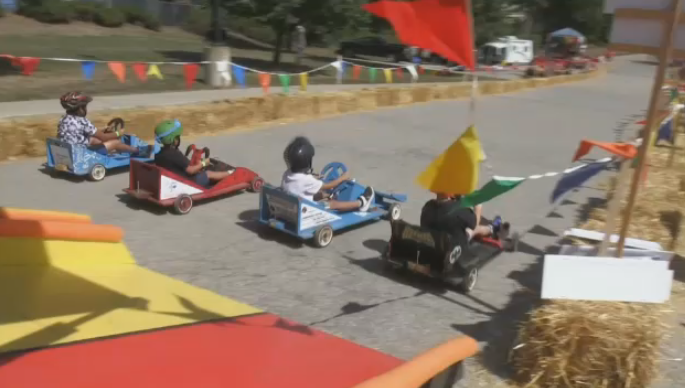 Soapbox cars race around the track at the Calvary Church in Cambridge's 17th annual derby on Sept. 10, 2022. (CTV Kitchener)