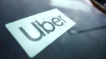An Uber sign is displayed inside a car in Palatine, Ill., Thursday, Feb. 10, 2022. (AP Photo/Nam Y. Huh) 