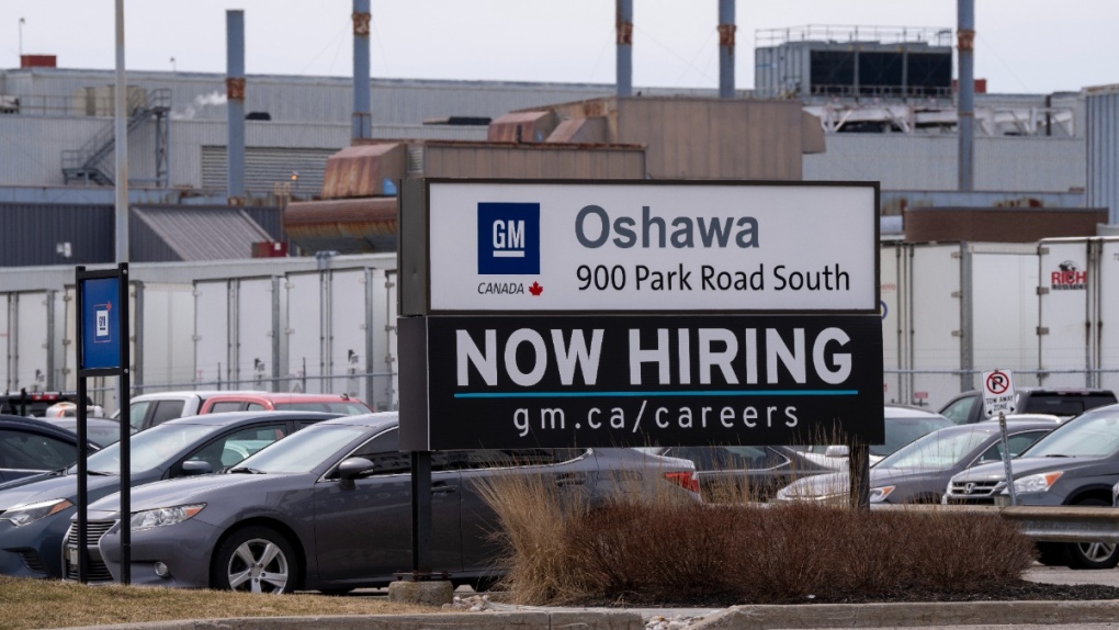 A sign announcing hiring at GM in Oshawa, Ont.