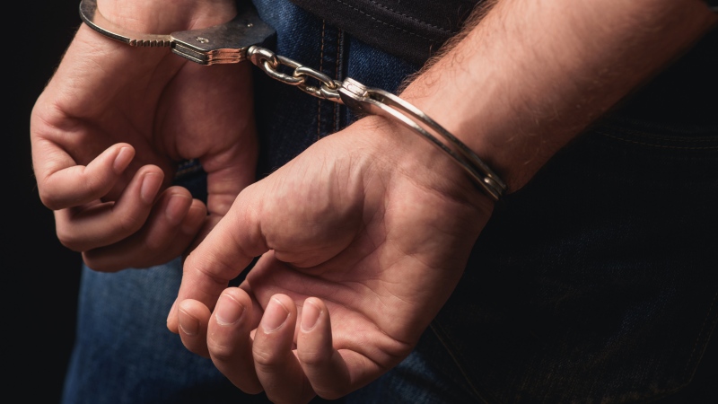 A person in handcuffs is seen in this undated stock image. (Shutterstock)