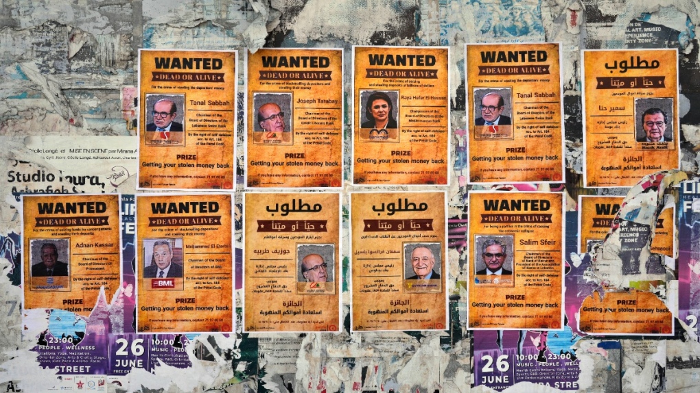 Mock 'wanted' posters of Lebanese bank execs