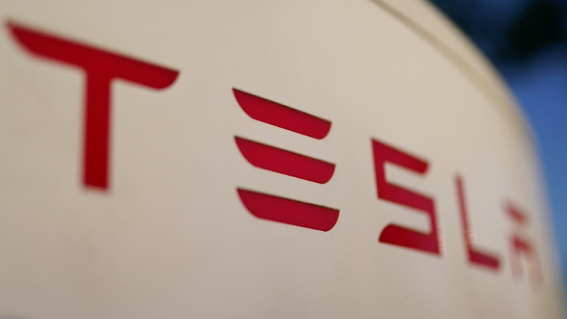 The logo for the Tesla Supercharger station is seen in Buford, Ga, April 22, 2021. (Chris Carlson / AP)
