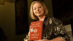 Winner of the 2009 Booker Prize for fiction Hilary Mantel with their book ' Wolf Hall,' in London, on Oct. 6, 2009. (Alastair Grant / AP)