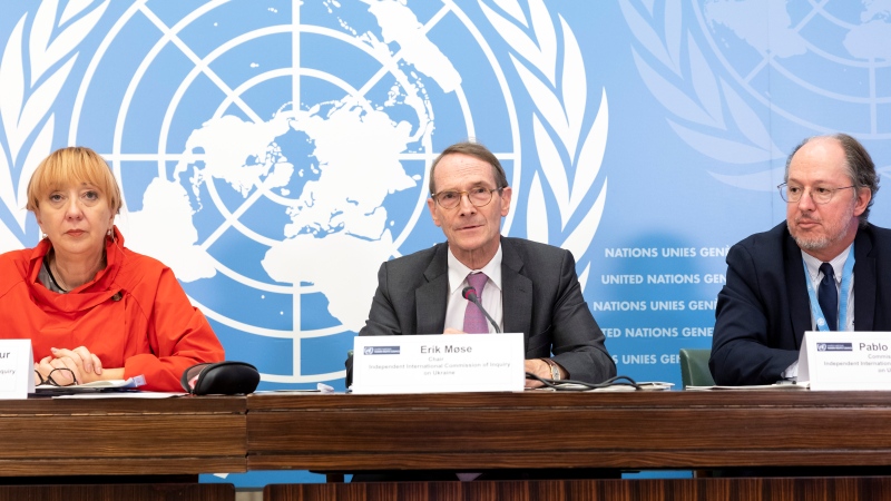 Erik Mose, center, Chair of the Commission of Inquiry on Ukraine, Jasminka Dzumhur, left, and Pablo de Greiff, right, Commissioners of Inquiry on Ukraine, talk to the media during a press conference following an update to the UN Human Rights Council, at the European headquarters of the United Nations in Geneva, Switzerland, Friday, Sept. 23, 2022.  (Salvatore Di Nolfi/Keystone via AP)