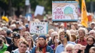 Climate activists attend a demonstration in Cologne, Germany, on Sept. 23, 2022. (Marius Becker / dpa via AP)